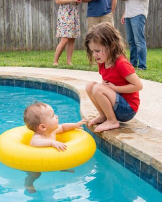 A Grandmother Hosting a Summer Pool Party Noticed Her Four-Year-Old Granddaughter Refusing to Swim and Sitting Alone Saying Her Stomach Hurt — Until the Little Girl Quietly Followed Her Into the Bathroom and Revealed the Truth Her Parents Told Her Never to Tell Anyone